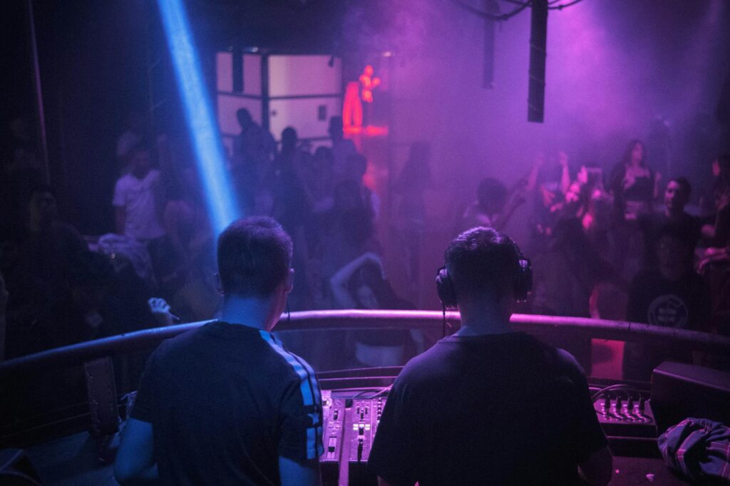 Shanghai nightclub dance floor with DJ and colorful lights