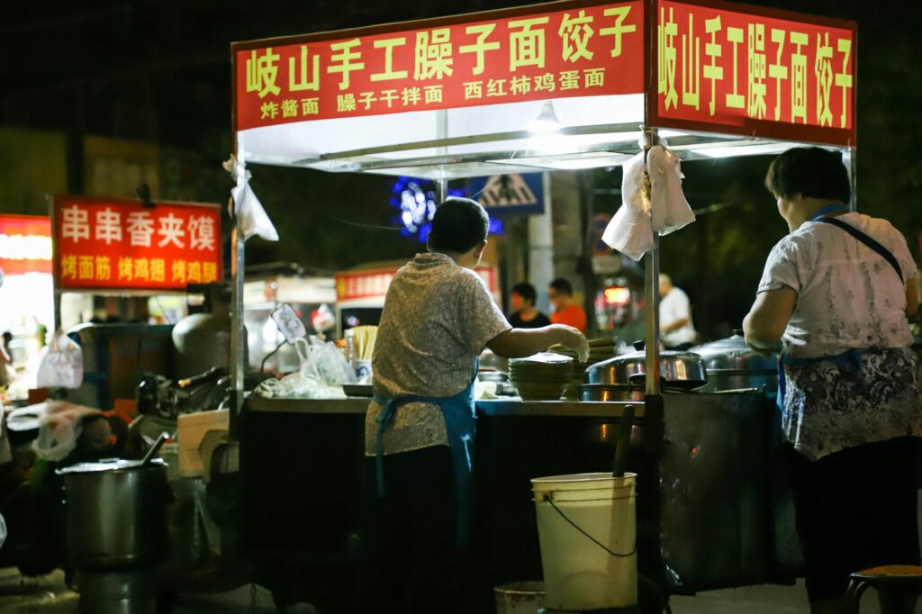 Shanghai street market with food vendors and local shopping atmosphere