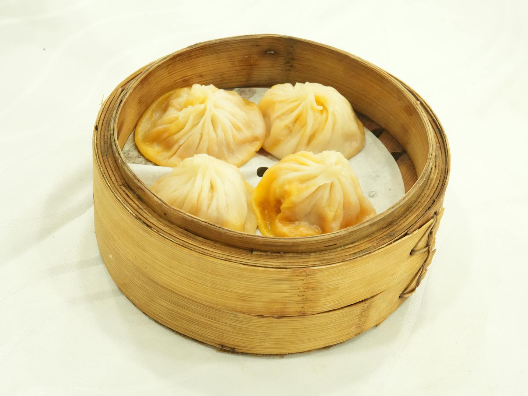 Best xiaolongbao in Shanghai detailed close-up of pleated dumpling