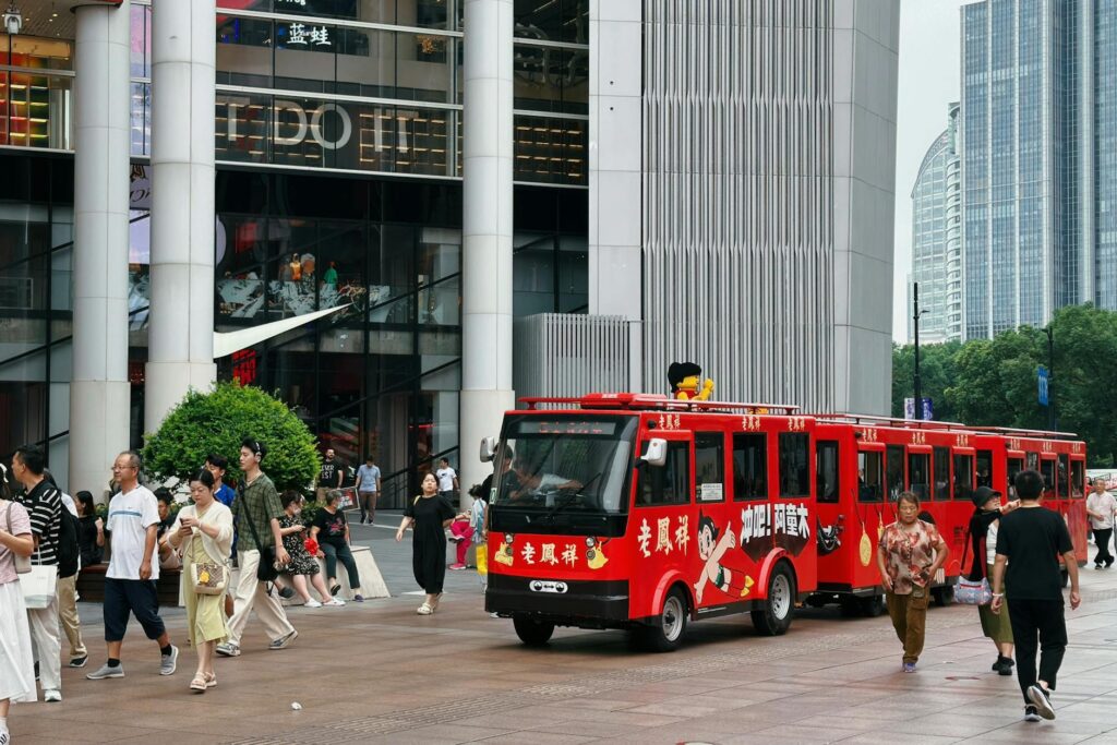 Nanjing Road Shanghai shopping pedestrian street with red tourist bus