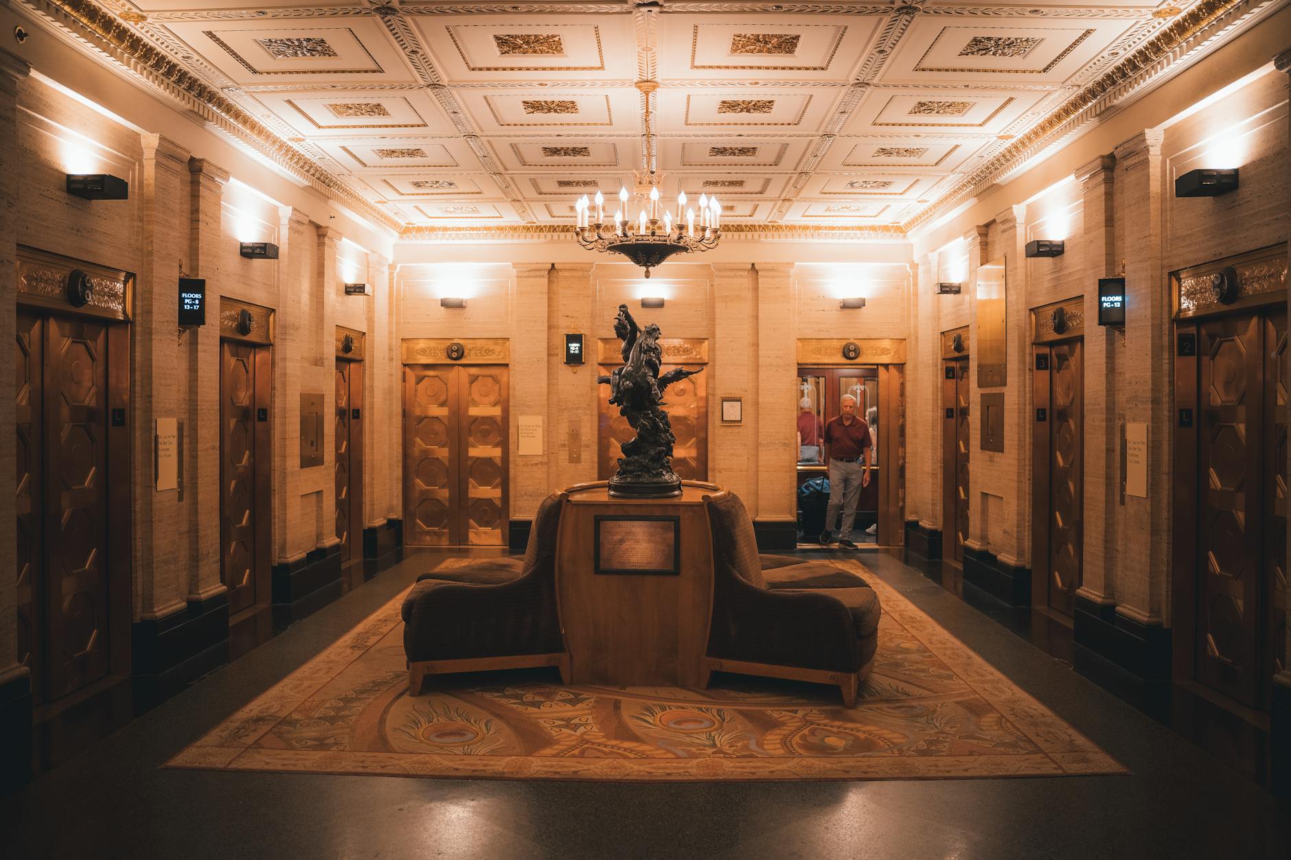 Shanghai Art Deco hotel lobby with ornate chandelier and bronze fittings