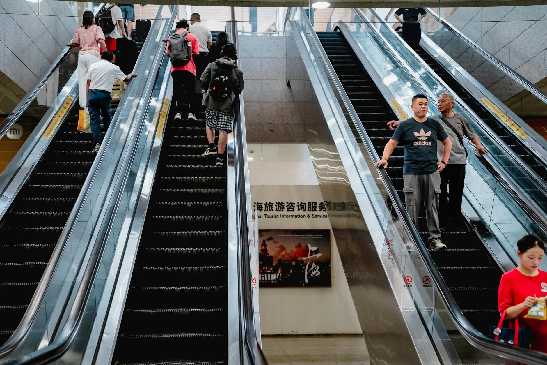 Shanghai metro guide busy escalators with passengers