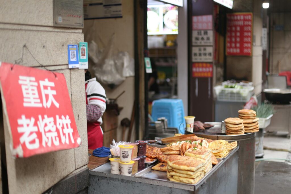 Shanghai street food guide vendor selling traditional Chinese pastries