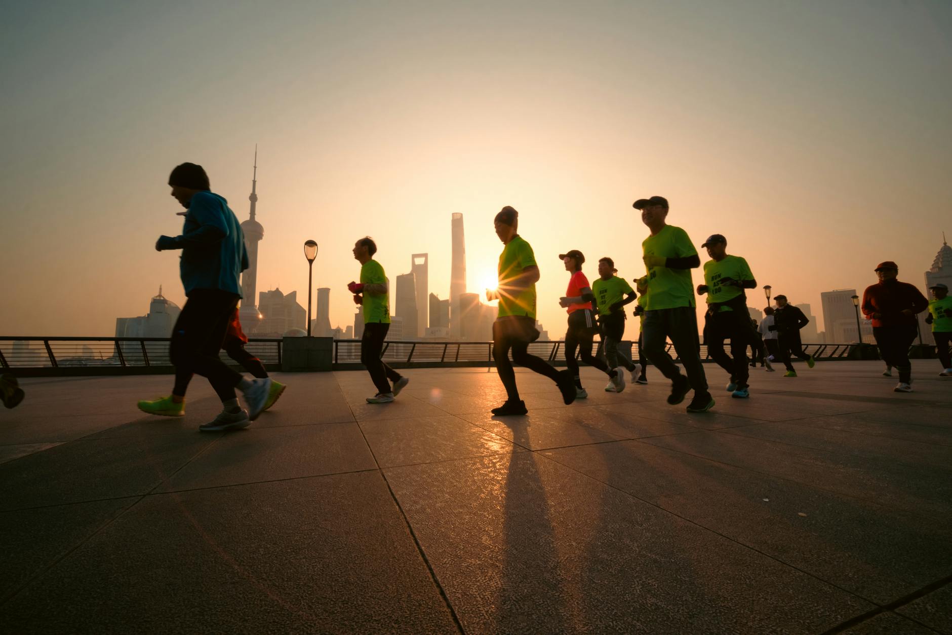 The Bund Shanghai sunrise morning runners along waterfront
