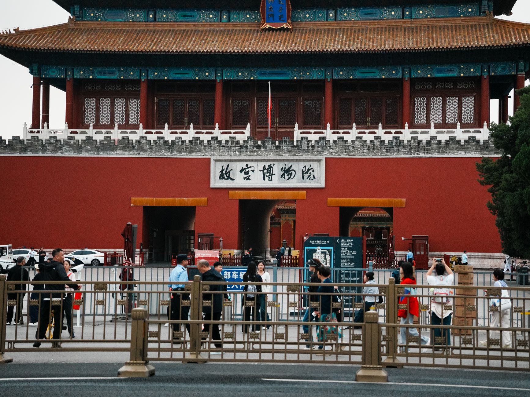 China tourist visa application form printout beside a passport