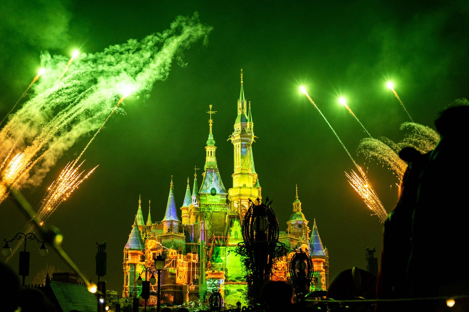 Fireworks light up a Disney castle at night, like the nightly Ignite the Dream show at Shanghai Disneyland