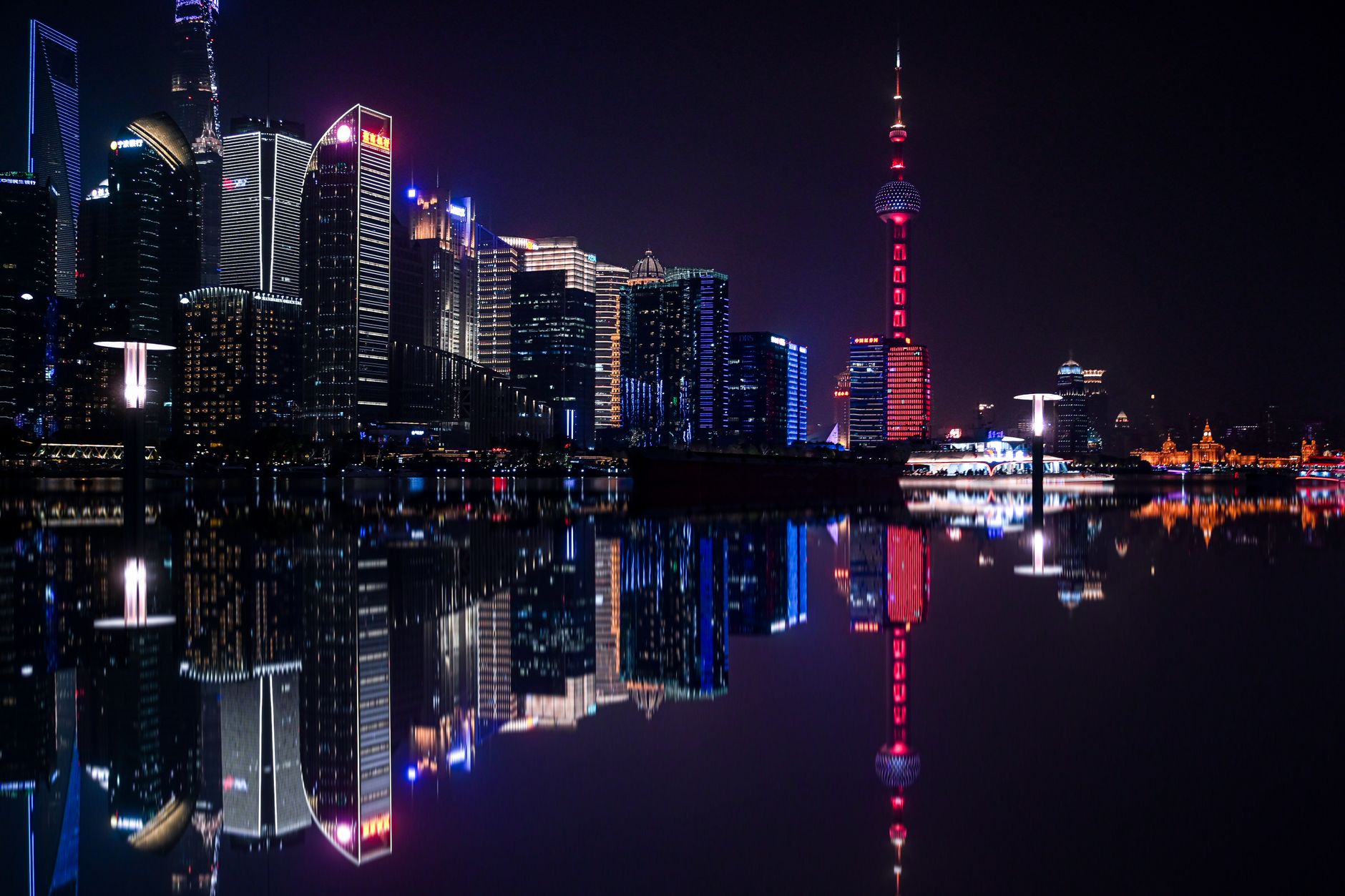 Pudong skyline lit up at night, the kind of view the Shanghai Tower observation deck delivers after sunset over the Huangpu River