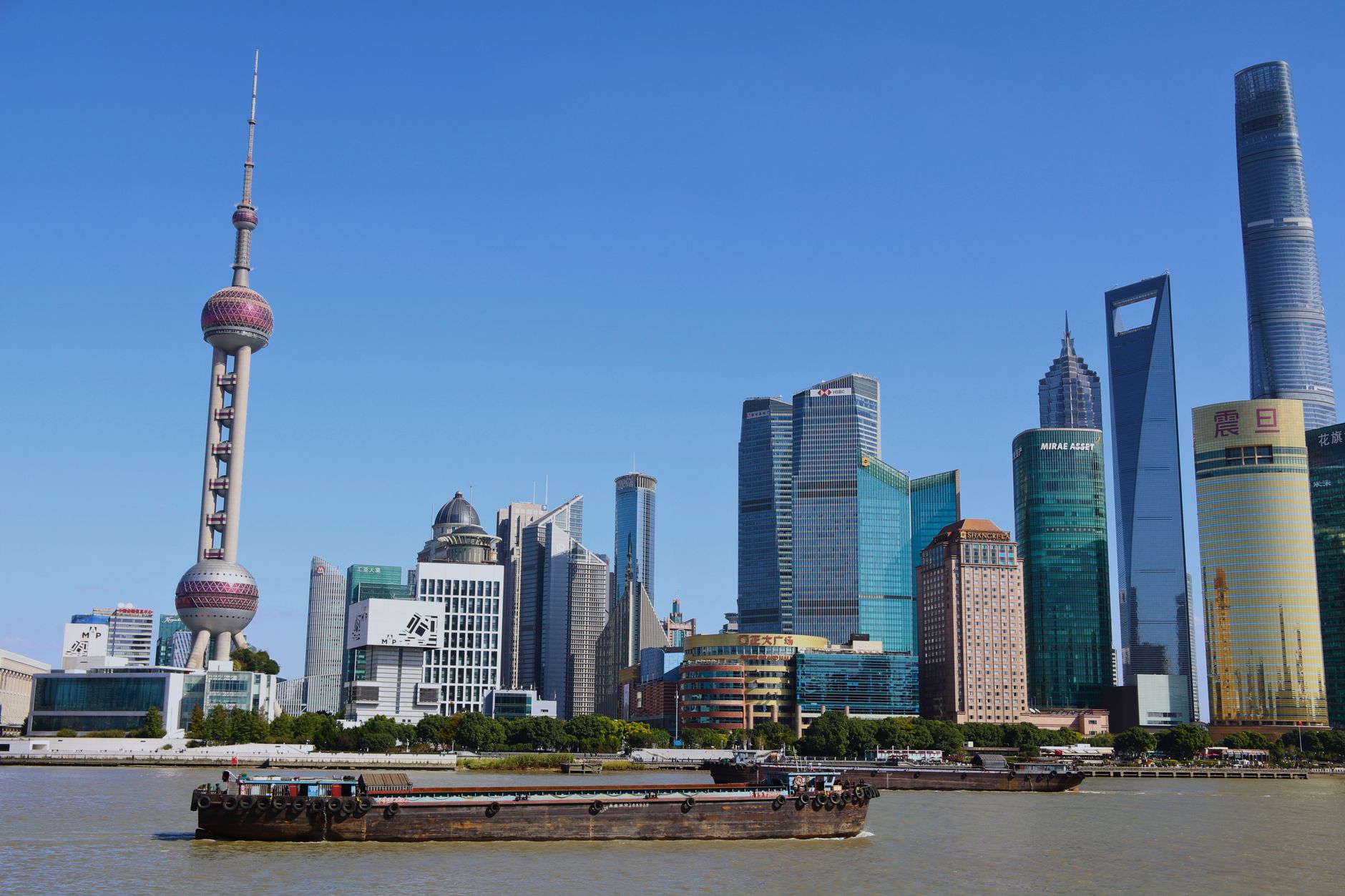 Shanghai Bund waterfront and Pudong towers across the Huangpu River