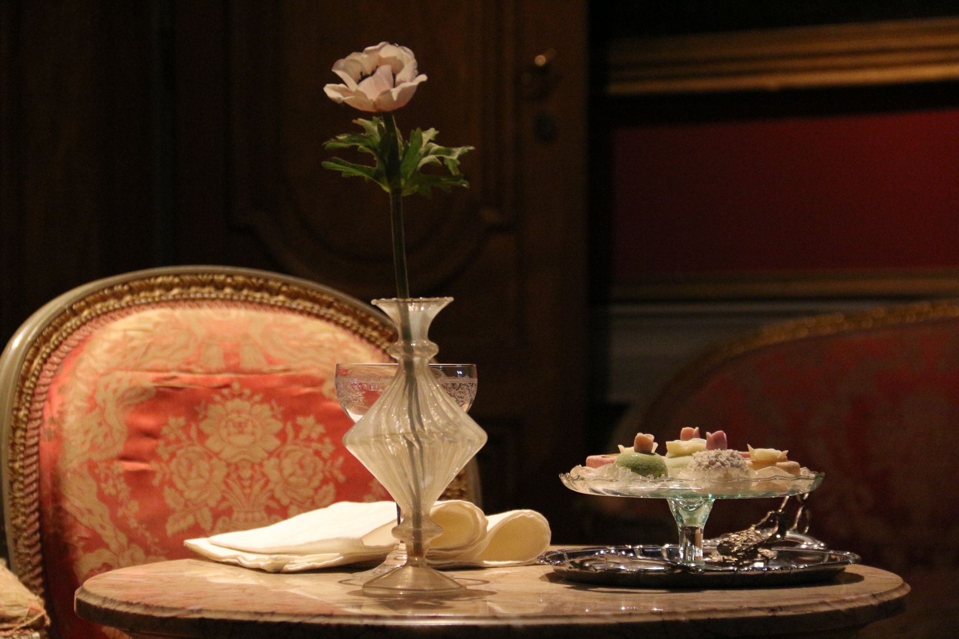 An afternoon tea setting with pastries in a classic hotel lounge, one way to visit a Shanghai luxury hotel without staying