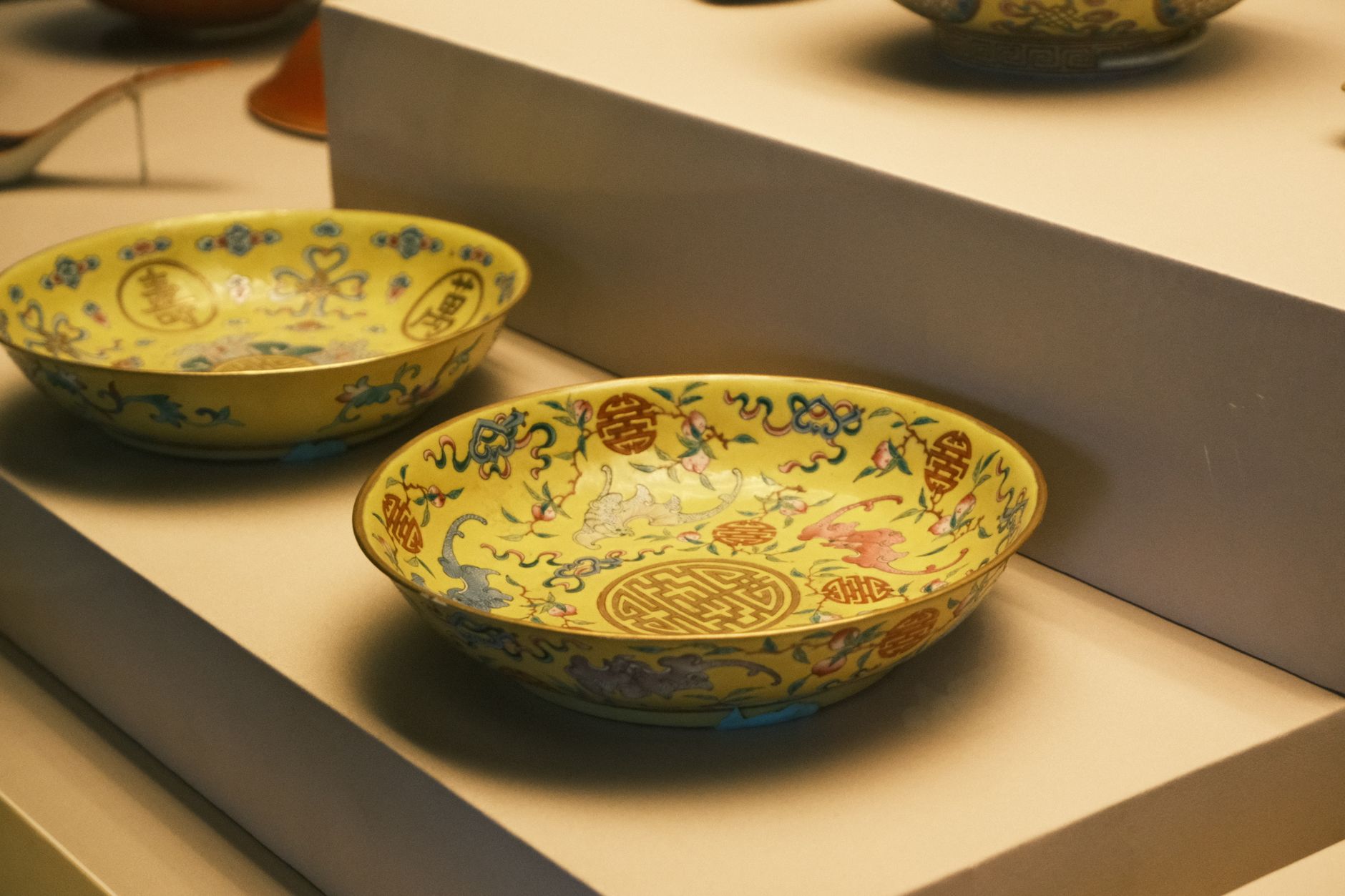 Painted Chinese porcelain in a museum display case, a staple of the ceramics galleries in Shanghai.