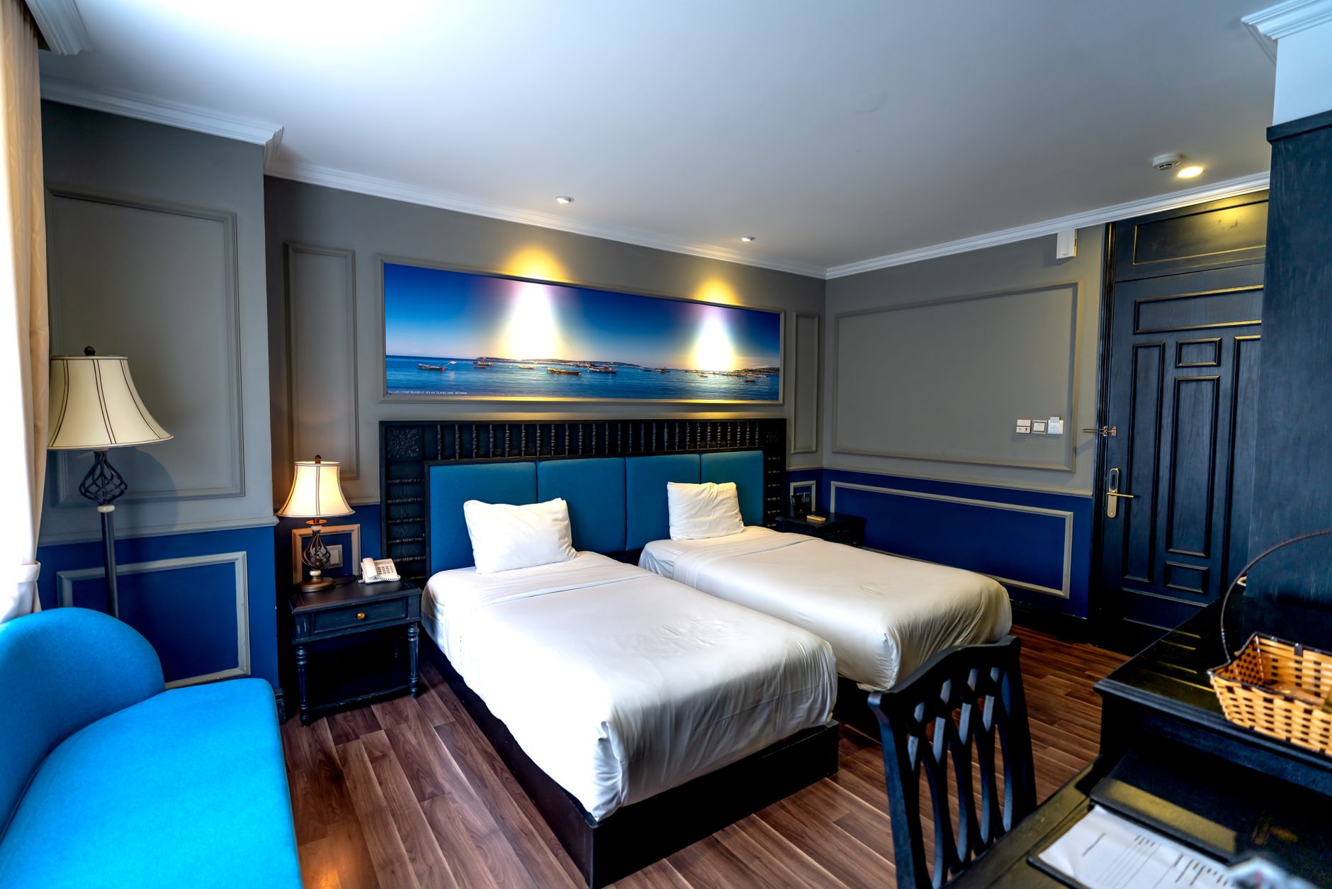 A hotel room with two beds, the configuration most useful to families travelling with children