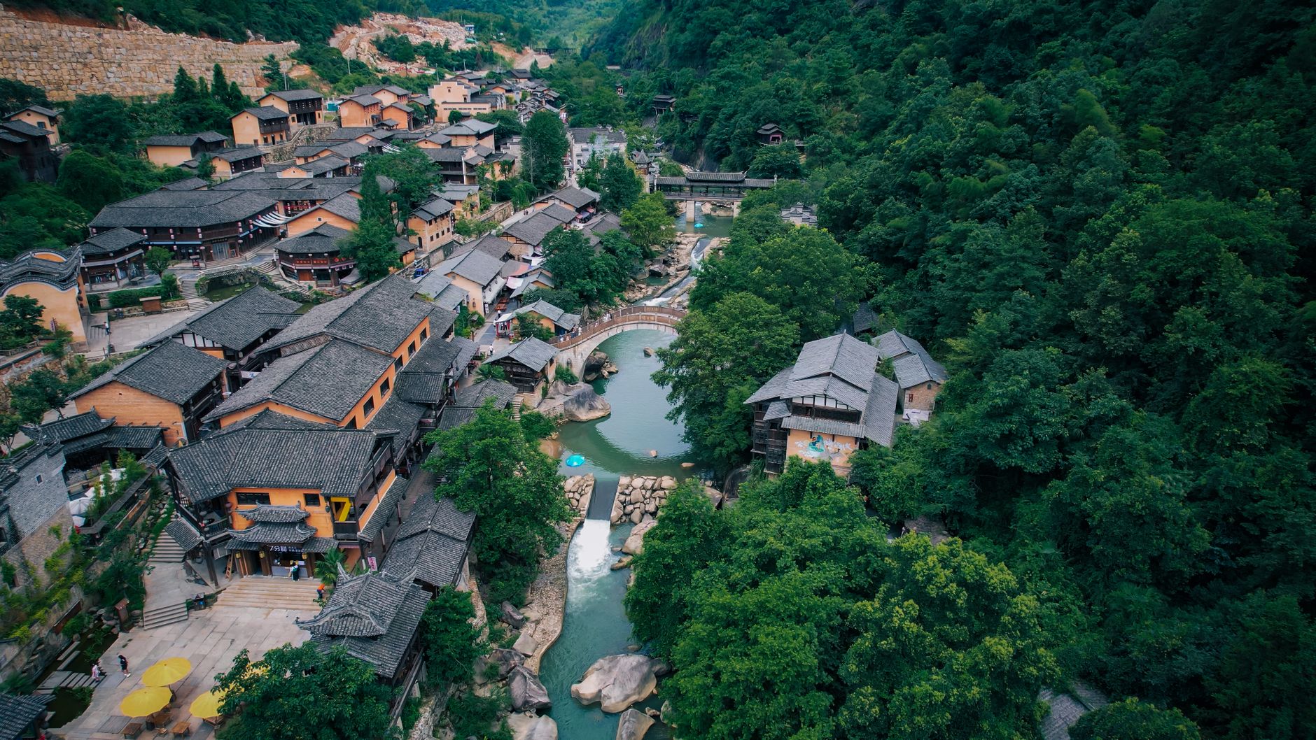 Stone houses and terraced fields in a green mountain village in eastern China