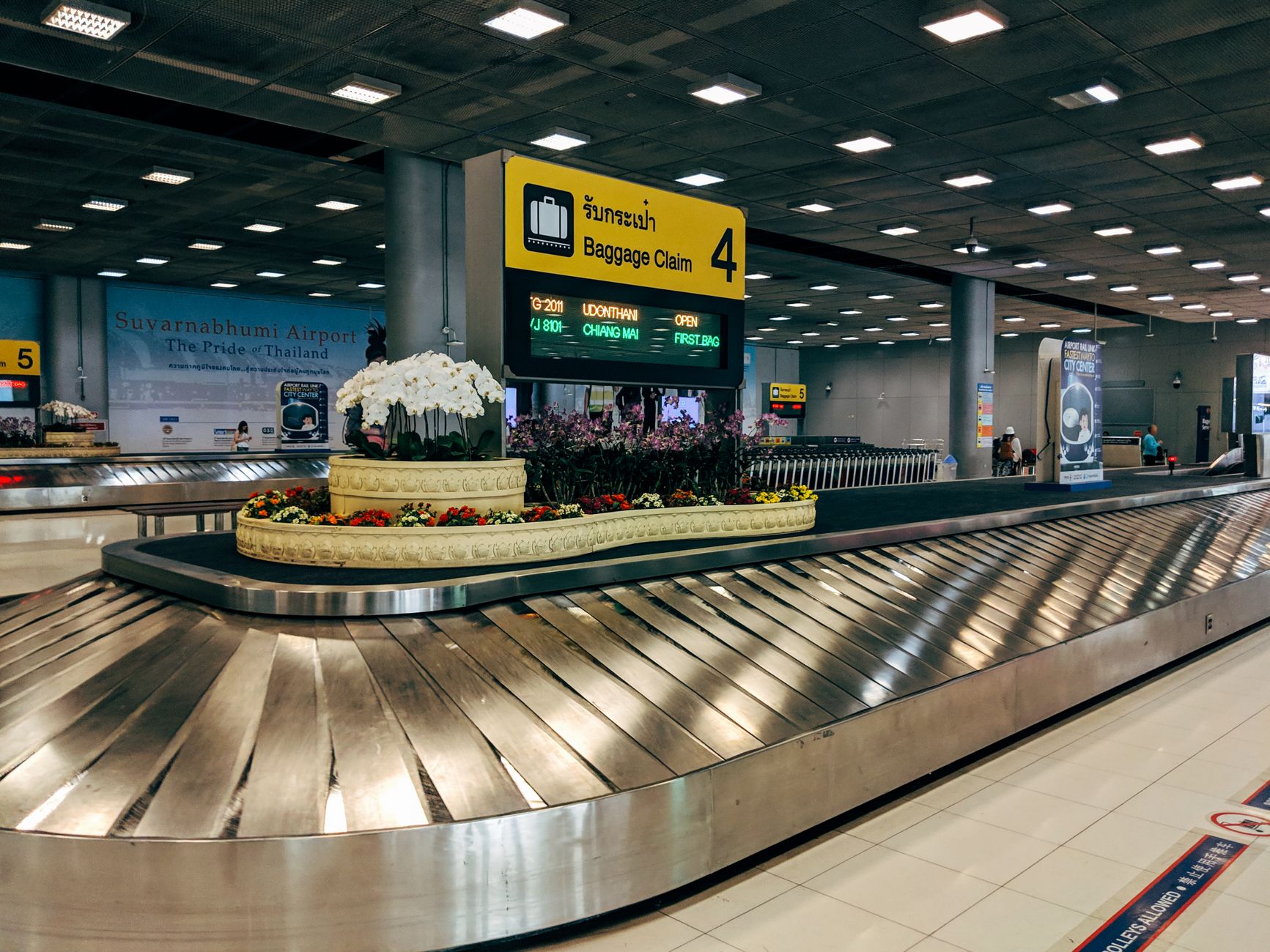 Baggage carousel in an airport arrivals hall where luggage is collected before customs