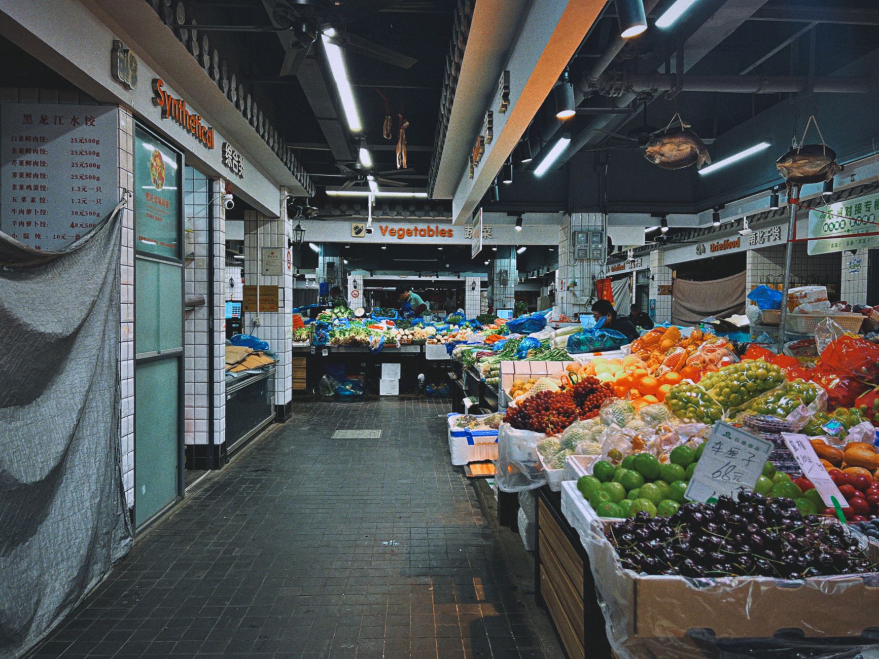 Fresh fruit and vegetables on display at an indoor produce market in Shanghai