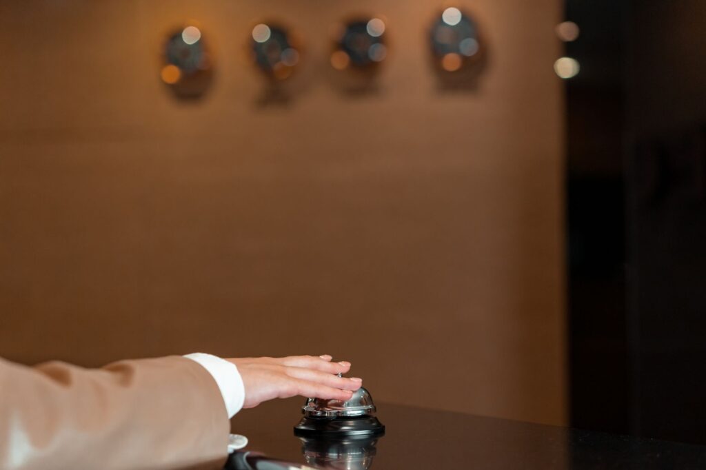 A hotel reception desk where staff register guests at check-in