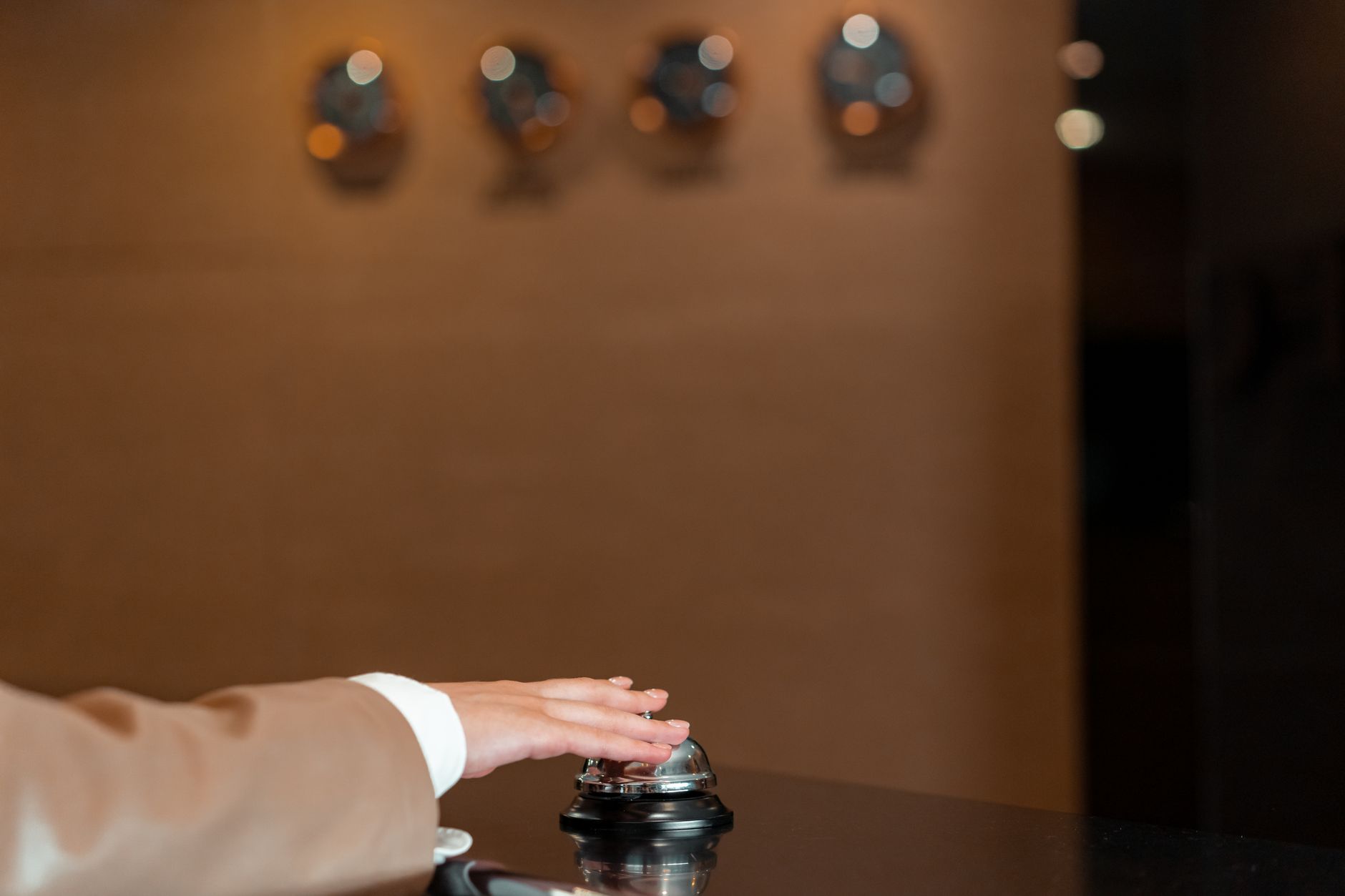 A hotel reception desk in Shanghai where staff register guests at check-in