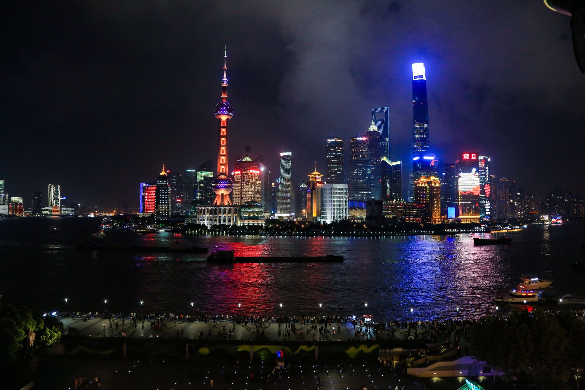 The illuminated Shanghai skyline reflected in the Huangpu River at night