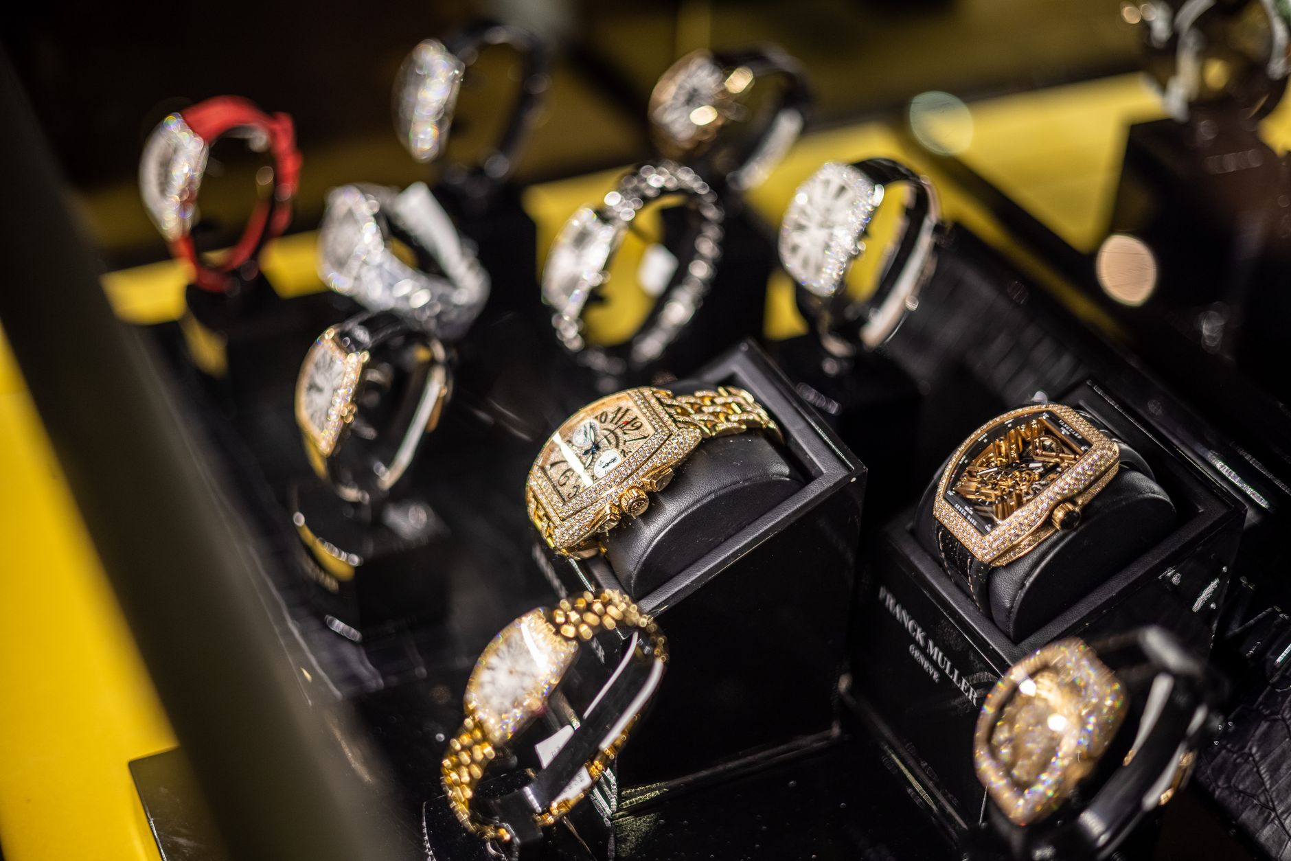 Gold and diamond watches displayed in the window of a high-end jewellery boutique