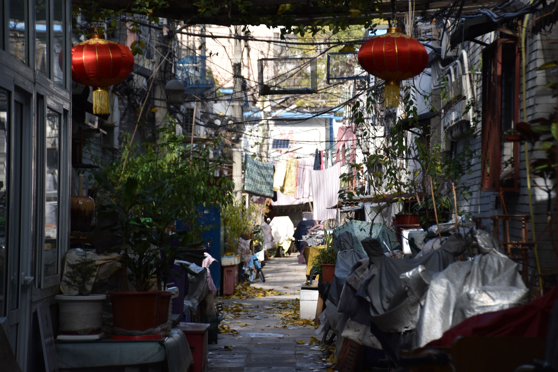 Washing hung out to dry across a narrow residential alley in an old Chinese neighbourhood