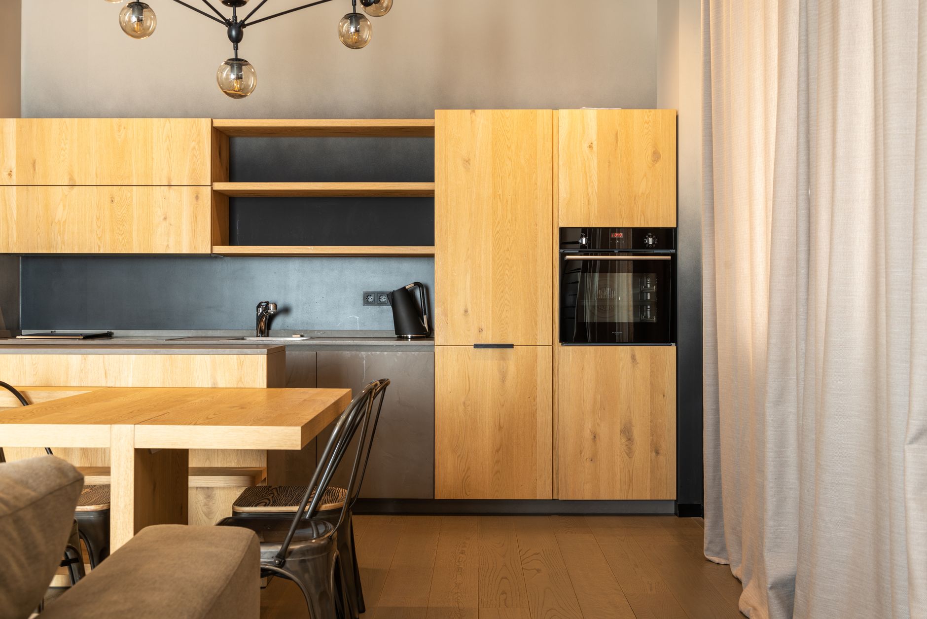 A serviced apartment kitchen with counter space and appliances