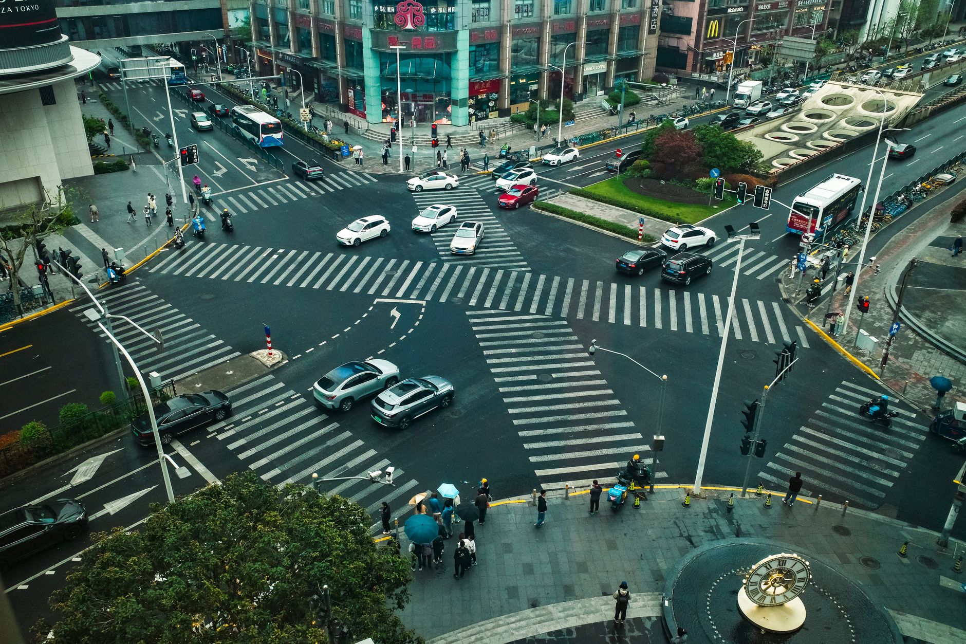 Aerial view of a busy Shanghai intersection with cars and pedestrians