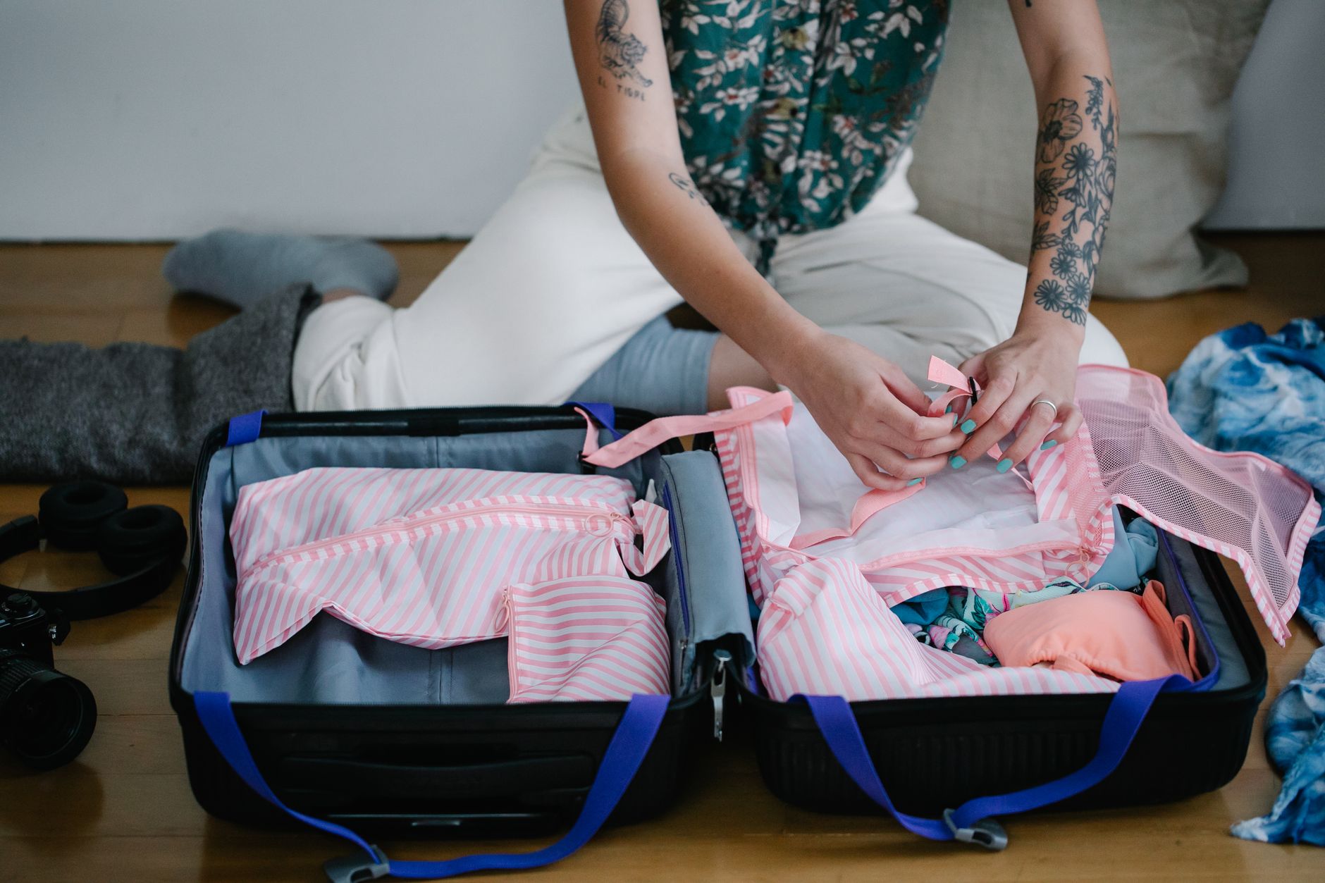 Clothes folded into an open suitcase before a trip to Shanghai