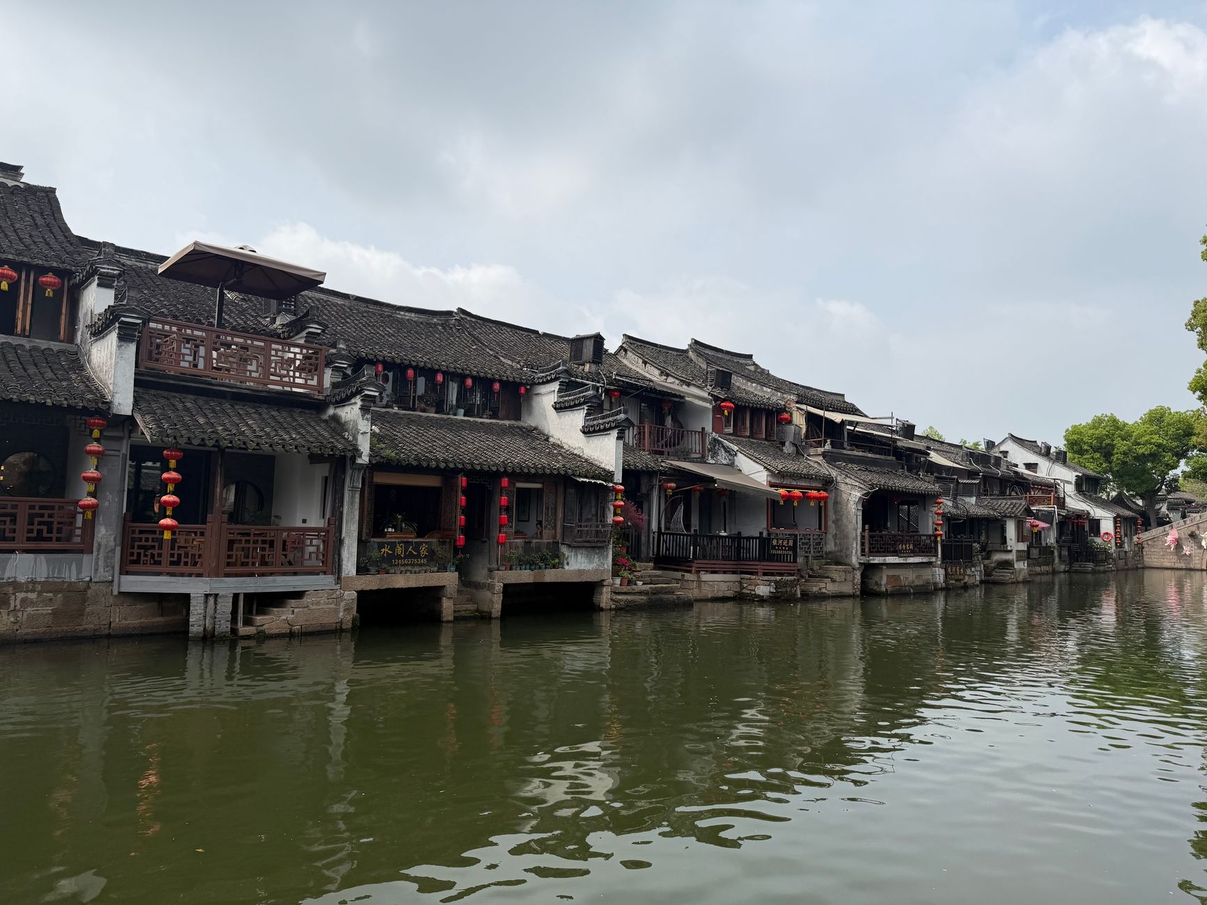 Timber-fronted houses along a canal in a restored Chinese water town