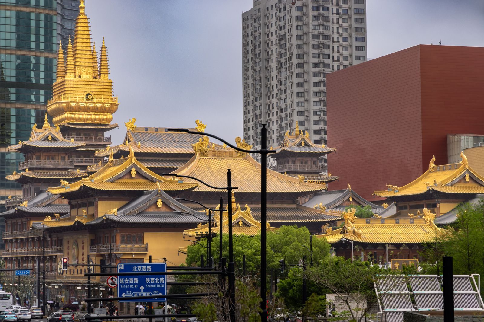 Golden roofs of Jing'an Temple surrounded by skyscrapers in Jing'an District, Shanghai