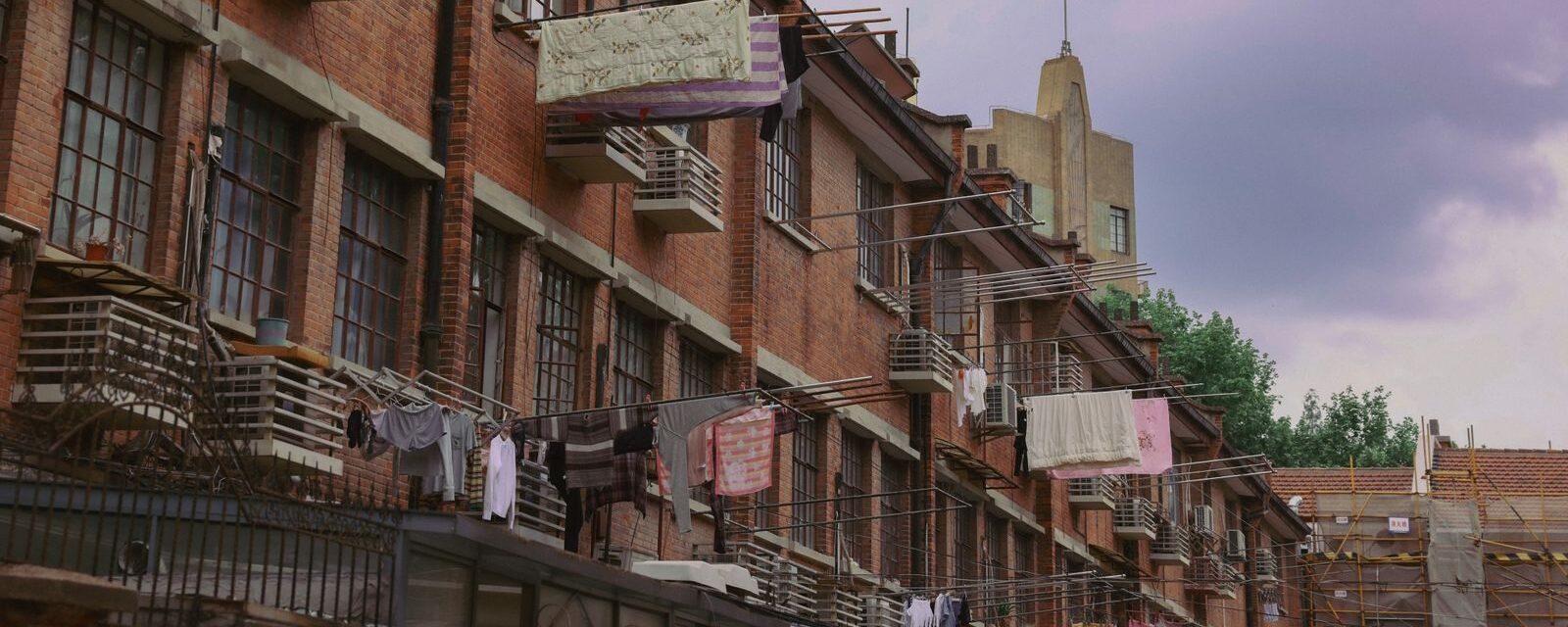 Brick shikumen lane houses in Shanghai with laundry drying from the windows