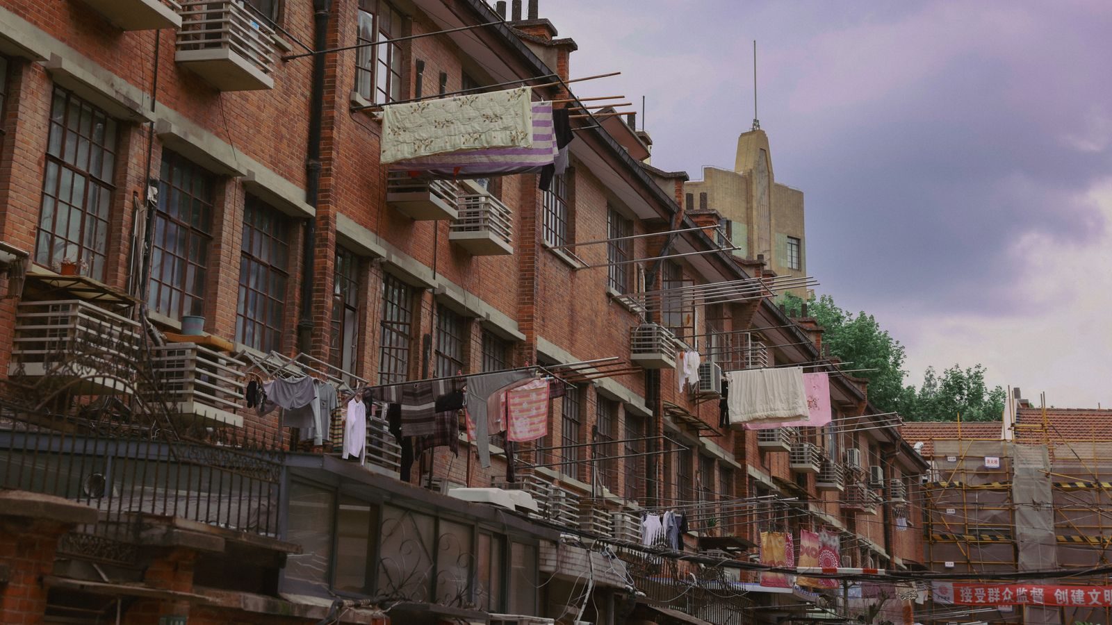 Brick shikumen lane houses in Shanghai with laundry drying from the windows