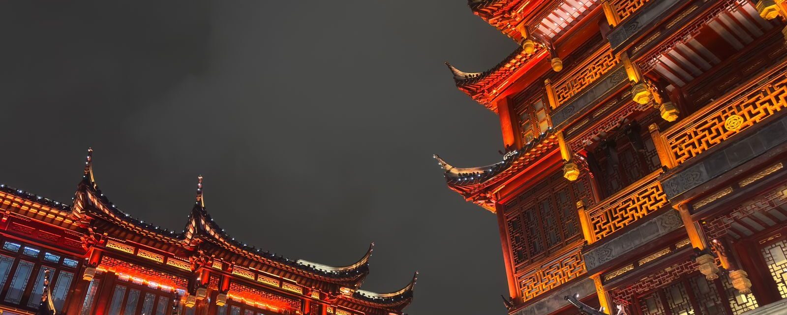 Illuminated traditional rooftops of the Yu Garden bazaar in Shanghai's Old City at night