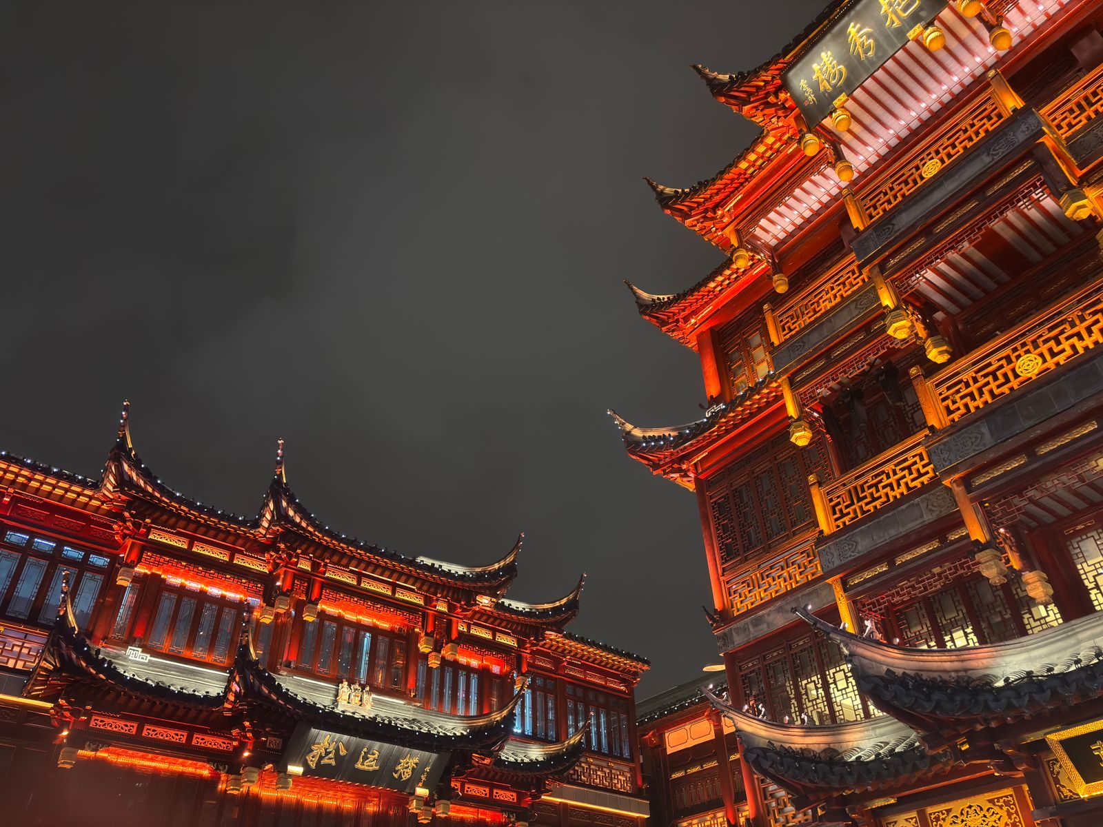 Illuminated traditional rooftops of the Yu Garden bazaar in Shanghai's Old City at night